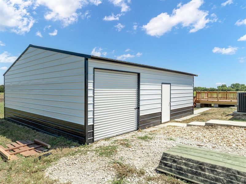 Concrete floor garage with roll up door and walk through door Concrete floor garage with roll up door and walk through door