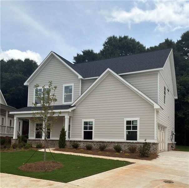Front exterior of a new home in , Covington, GA, highlighting curb appeal (Image 2). Front exterior of a new home in , Covington, GA, highlighting curb appeal (Image 2).