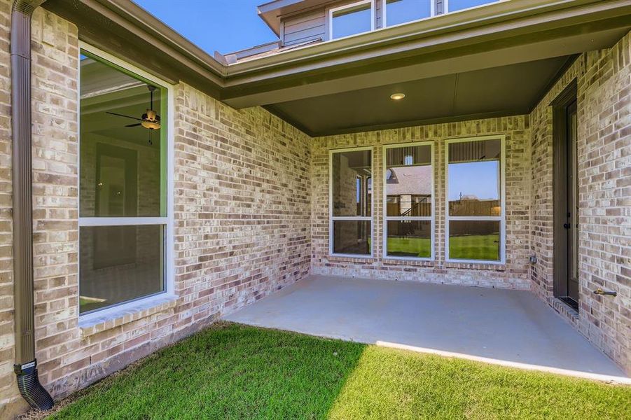 View of patio featuring a ceiling fan