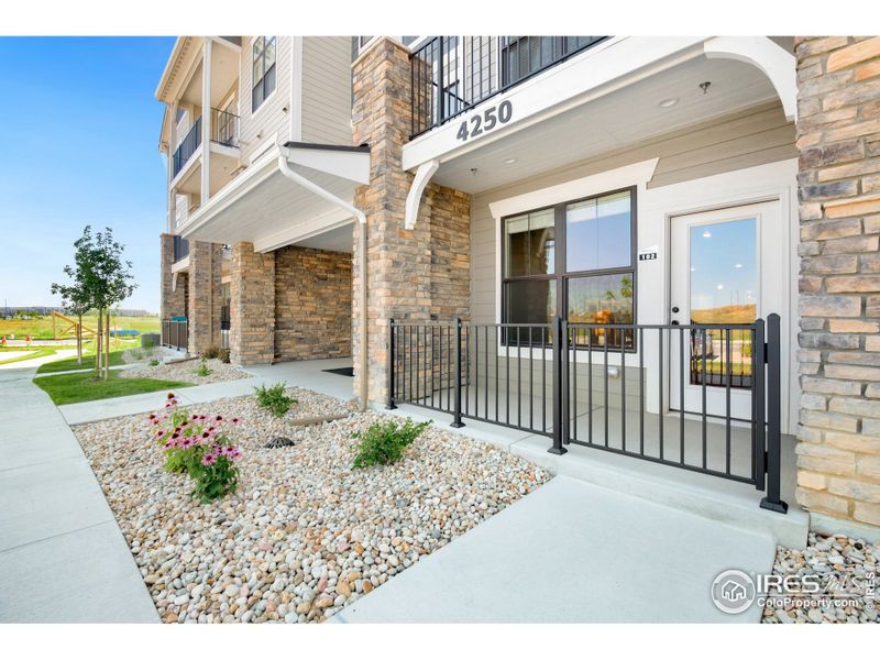 First-floor unit w/ gated, covered porch.