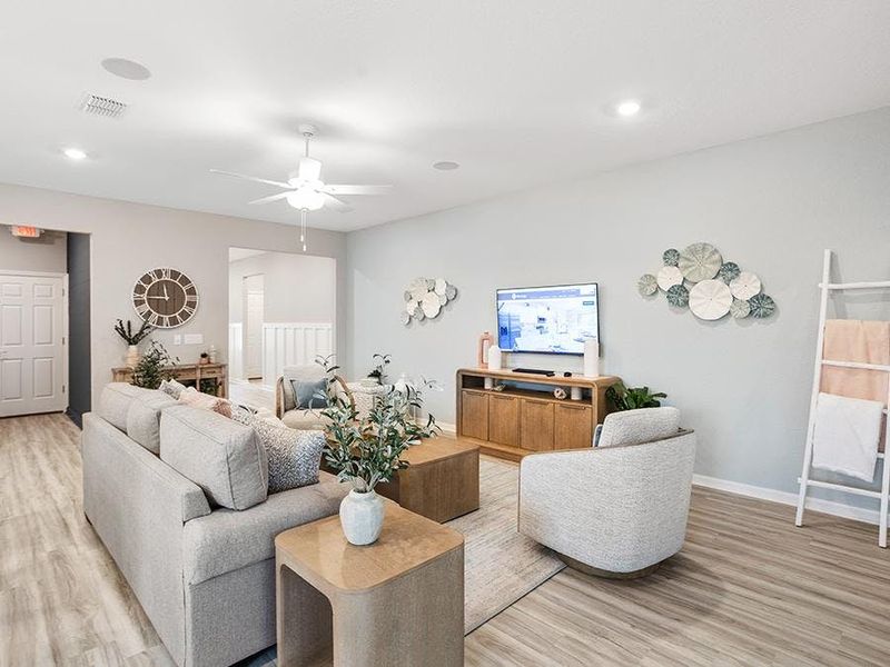 The large gathering room provides space for comfortable seating arrangements - Aubrey by Highland Homes