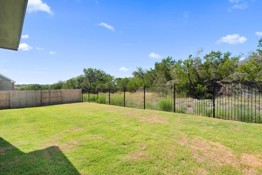 Exterior details and patio area of a home in Lariat, Liberty Hill (Image 29).