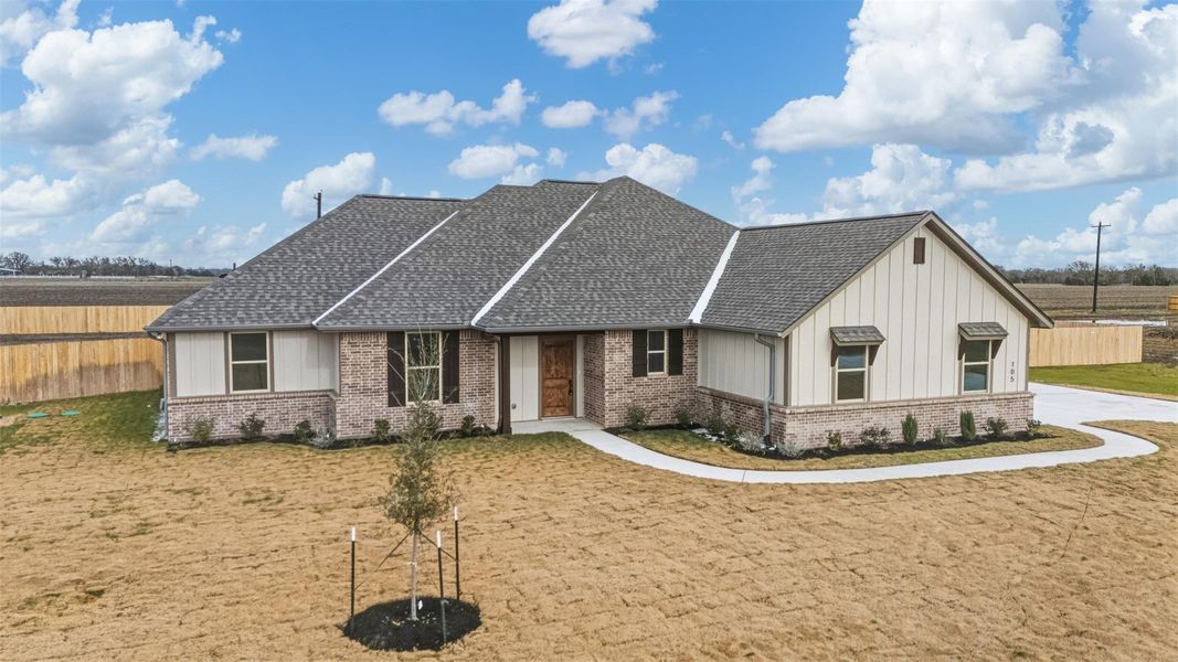 Front exterior of a new home in , Snook, TX, highlighting curb appeal (Image 2). Front exterior of a new home in , Snook, TX, highlighting curb appeal (Image 2).