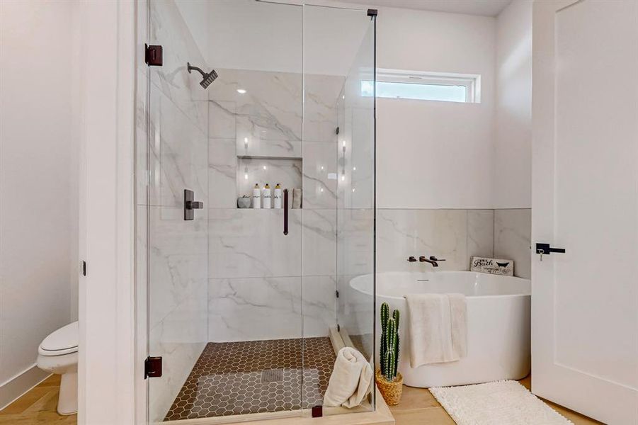 Main Bathroom with a shower with shower door and toilet