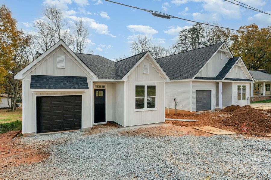 Front exterior of a new home in , Lowell, NC, highlighting curb appeal (Image 2). Front exterior of a new home in , Lowell, NC, highlighting curb appeal (Image 2).