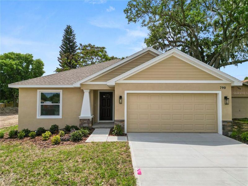 Front exterior of a new home in , Eagle Lake, FL, highlighting curb appeal (Image 26).