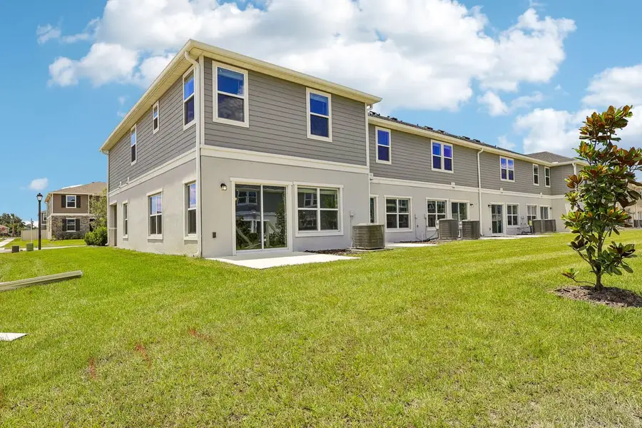 Exterior details and patio area of a home in Reserve at Forest Lake Townhomes, Lake Wales (Image 4).