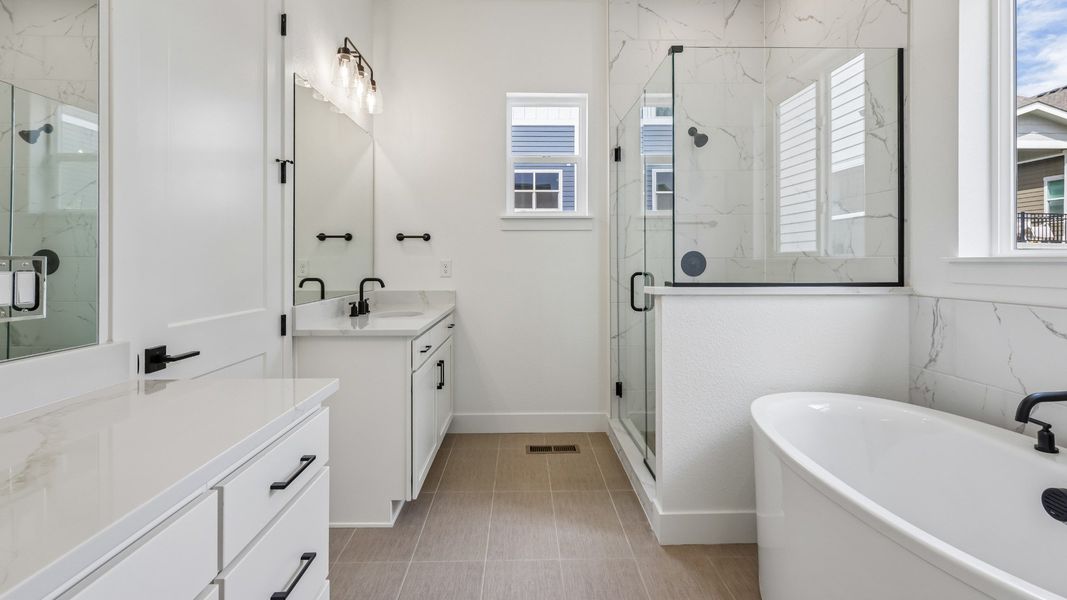A thoughtfully designed owner's bath created for daily comfort A thoughtfully designed owner's bath created for daily comfort