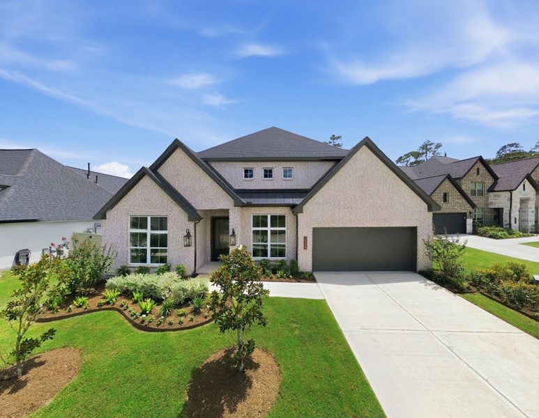 Front exterior of a new home in Audubon 60′, Magnolia, TX, highlighting curb appeal (Image 1). Front exterior of a new home in Audubon 60′, Magnolia, TX, highlighting curb appeal (Image 1).
