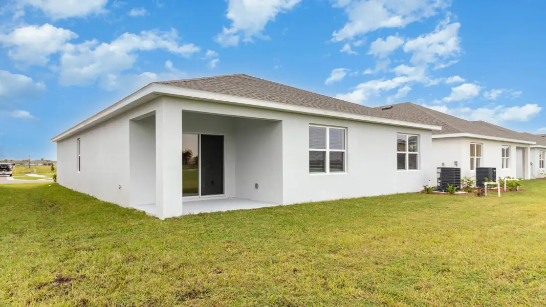 Exterior details and patio area of a home in Cypress Bay West, Palm Bay (Image 3).