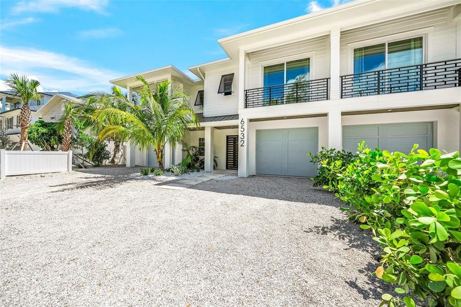 Front exterior of a new home in , Sarasota, FL, highlighting curb appeal (Image 27).