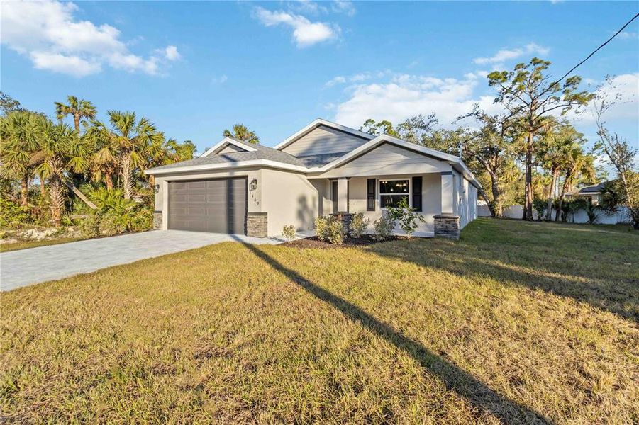 Front exterior of a new home in , North Port, FL, highlighting curb appeal (Image 25). Front exterior of a new home in , North Port, FL, highlighting curb appeal (Image 25).