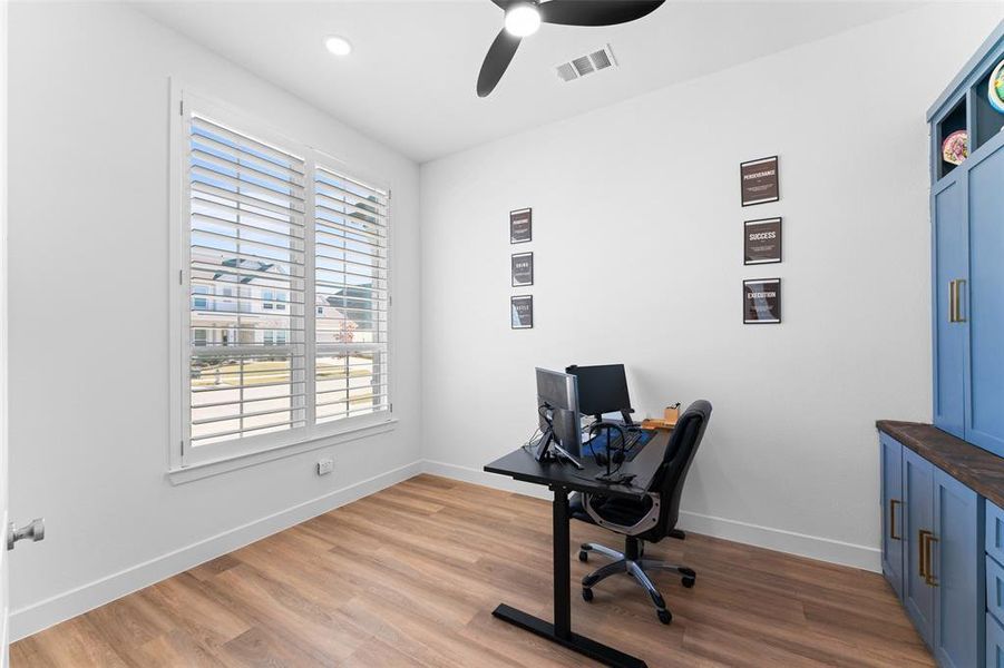 Home office with ceiling fan, light wood-style floors, and recessed lighting Home office with ceiling fan, light wood-style floors, and recessed lighting