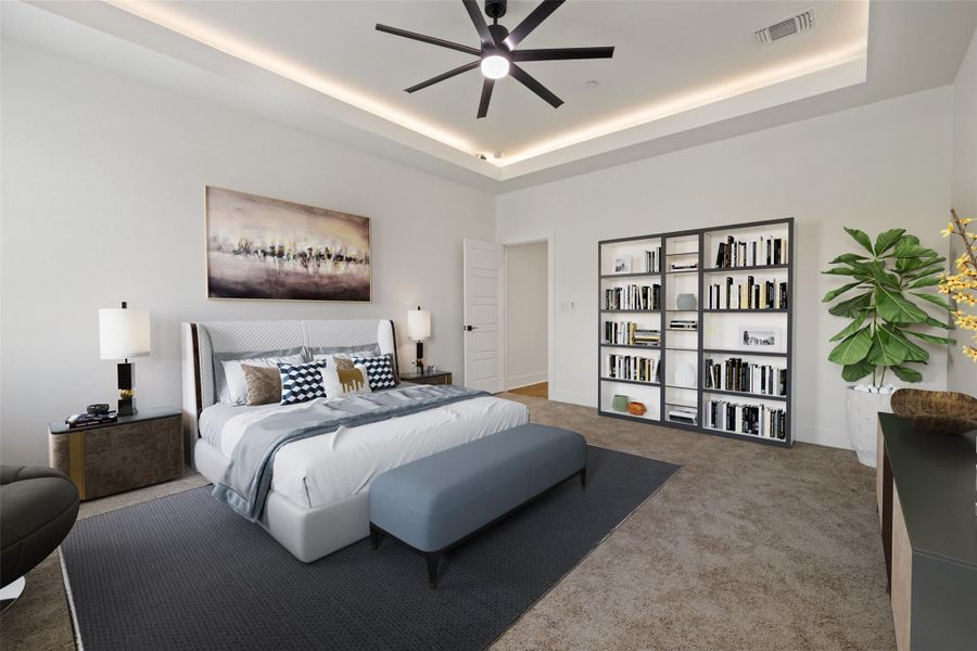 Carpeted bedroom with a tray ceiling and a ceiling fan Carpeted bedroom with a tray ceiling and a ceiling fan