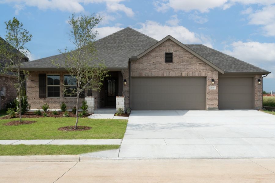 Front exterior of a new home in Verandah, Royse City, TX, highlighting curb appeal (Image 1). Front exterior of a new home in Verandah, Royse City, TX, highlighting curb appeal (Image 1).