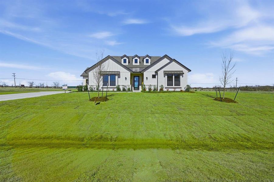 Front exterior of a new home in Highland Crossing, Celina, TX, highlighting curb appeal (Image 19).
