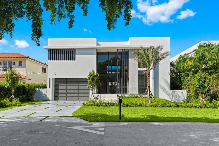 Front exterior of a new home in , Sunny Isles Beach, FL, highlighting curb appeal (Image 1). Front exterior of a new home in , Sunny Isles Beach, FL, highlighting curb appeal (Image 1).
