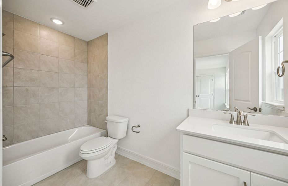 Upgraded secondary bath with elegant finishes  *Real home pictured