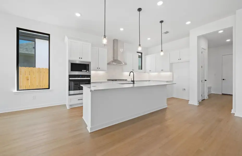 Furnished interior view inside a new home in 6 Creeks, Kyle (Image 4).