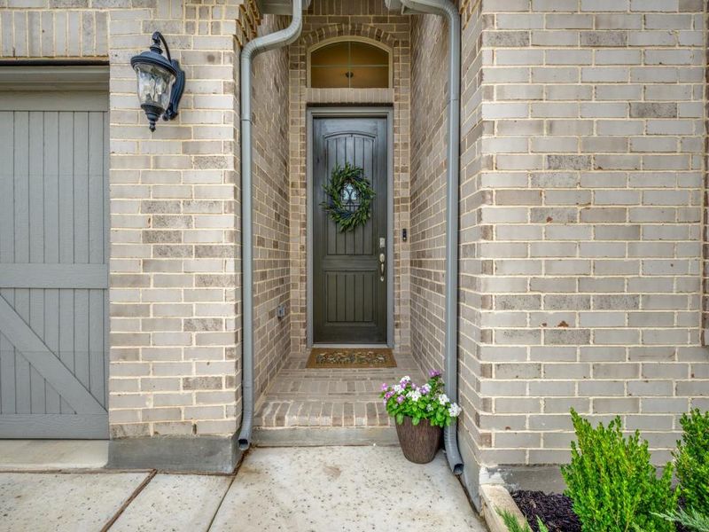 Front porch sets the tone for the home with its classic charm and curb appeal.