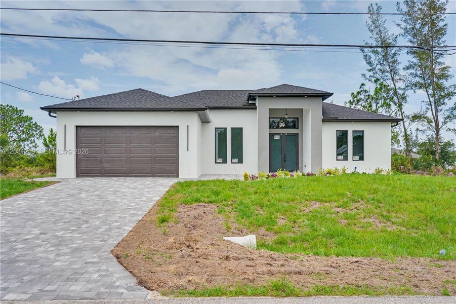 Front exterior of a new home in , Cape Coral, FL, highlighting curb appeal (Image 21).