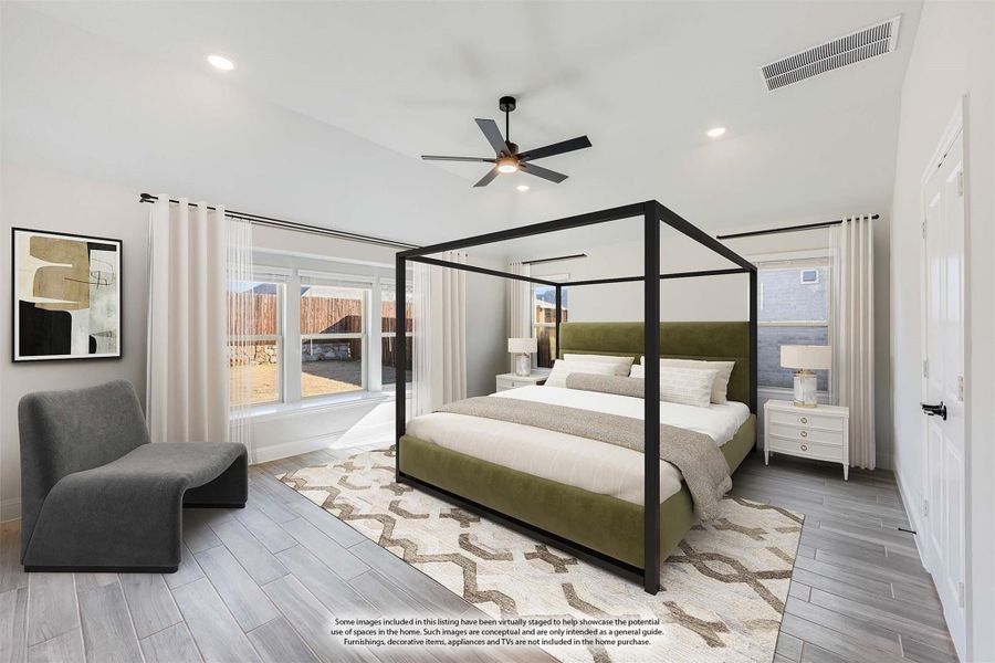 Bedroom with black four-poster bed, green upholstered headboard, ceiling fan, and wood-look tile floors Bedroom with black four-poster bed, green upholstered headboard, ceiling fan, and wood-look tile floors