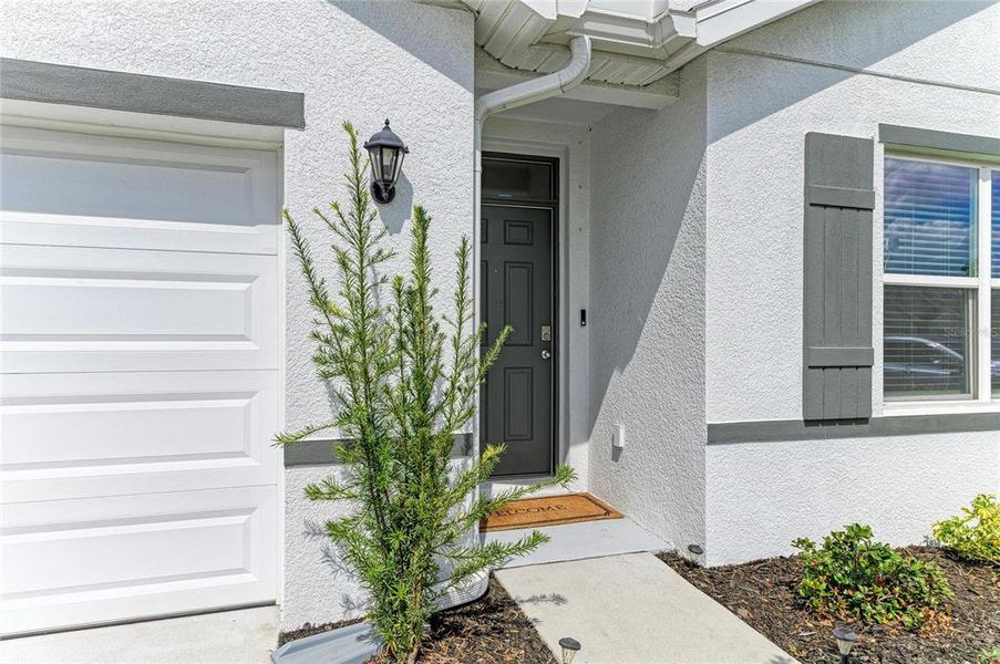 Exterior details and patio area of a home in Rye Crossing, Parrish (Image 24).