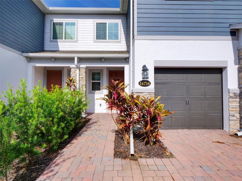 Front exterior of a new home in , Orlando, FL, highlighting curb appeal (Image 19).