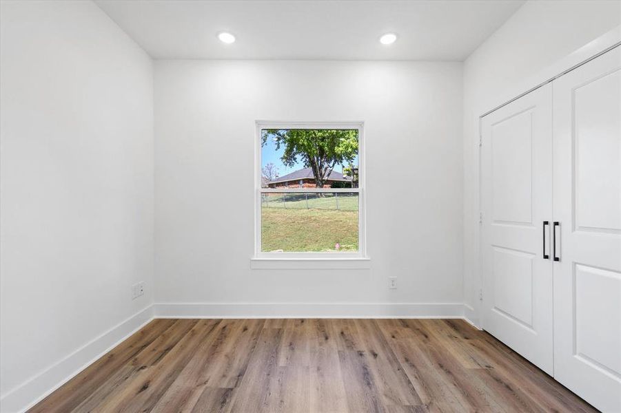 Unfurnished room featuring hardwood / wood-style flooring