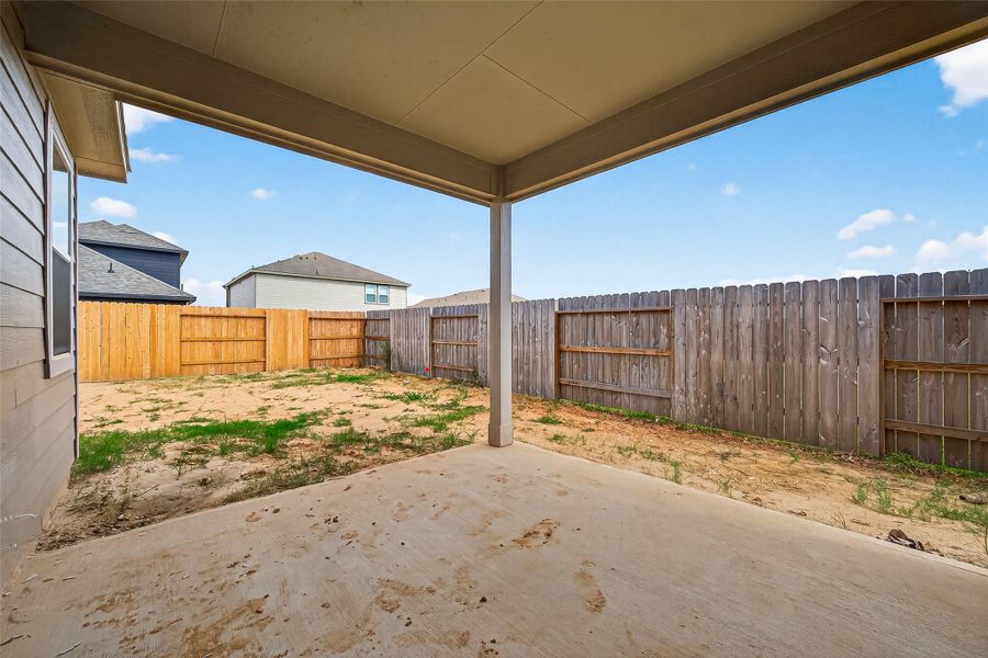 Exterior details and patio area of a home in Sunterra, Katy (Image 4).