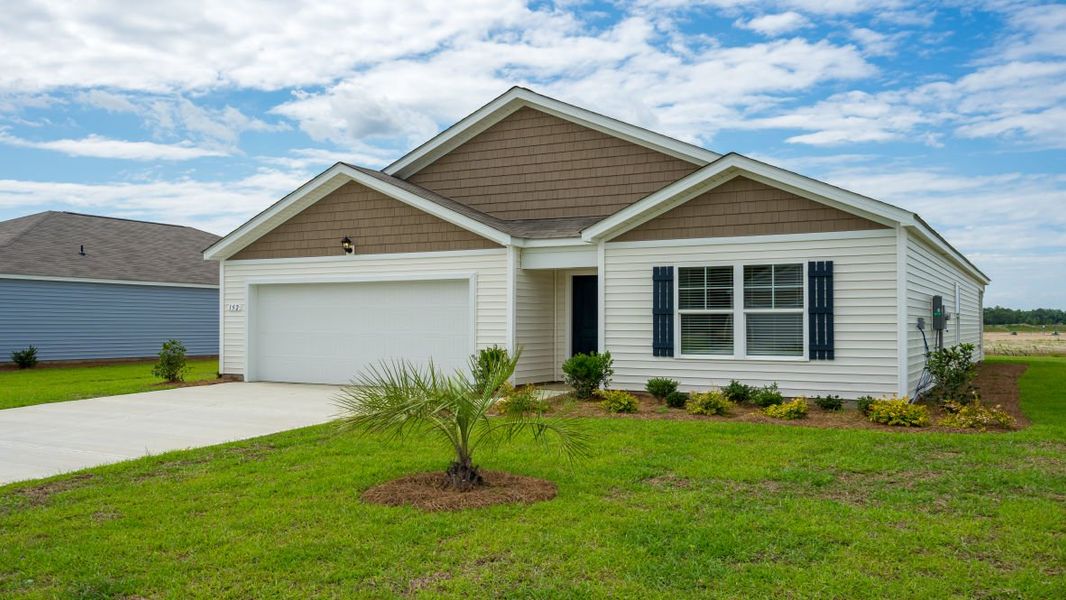 Front exterior of a new home in Cottonwood Place, Tabor City, NC, highlighting curb appeal (Image 18). Front exterior of a new home in Cottonwood Place, Tabor City, NC, highlighting curb appeal (Image 18).