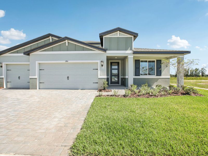 Front exterior of a new home in Two Rivers - Signature Series, Zephyrhills, FL, highlighting curb appeal (Image 1).