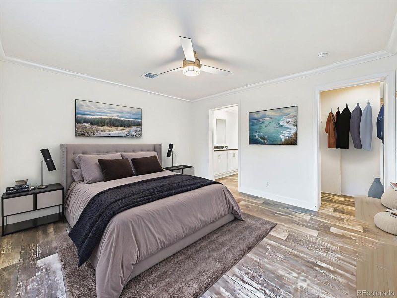 Virtually Staged Spacious primary suite with large window bringing in natural light.