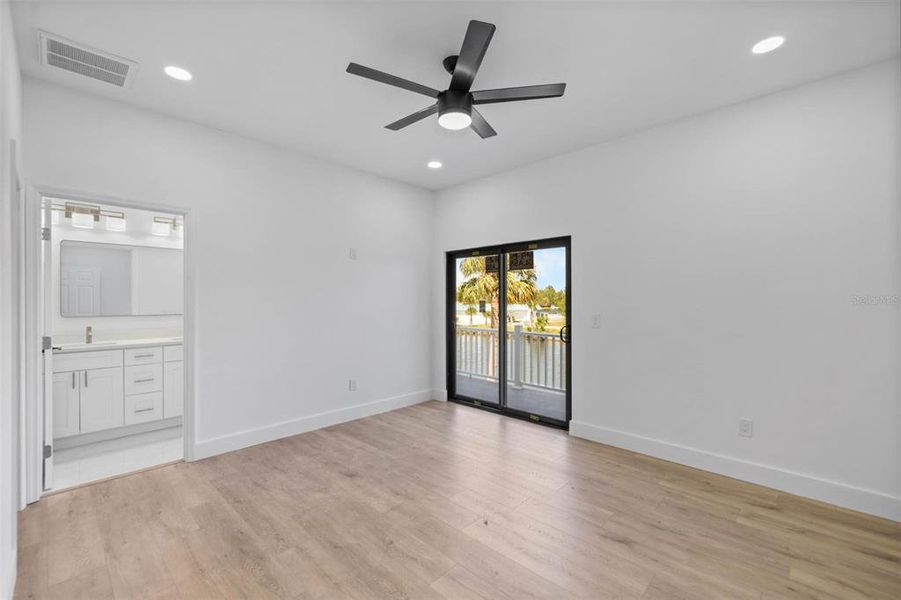 Primary Bedroom has slider access to the back porch