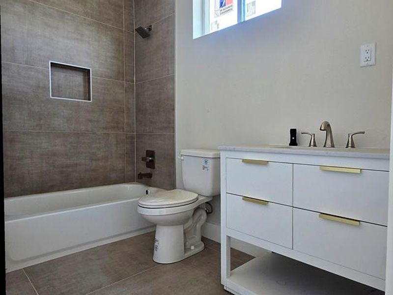 Full bathroom featuring vanity and shower / bath combination