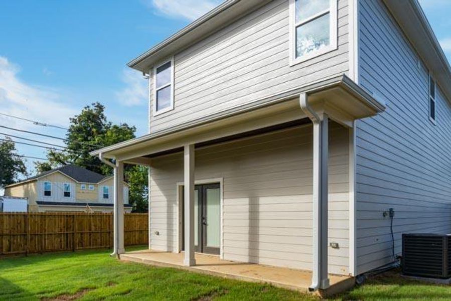 Back of house with a patio