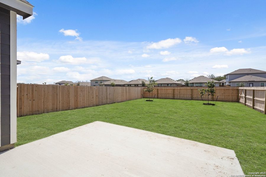 Front exterior of a new home in Abbott Place, St. Hedwig, TX, highlighting curb appeal (Image 2).