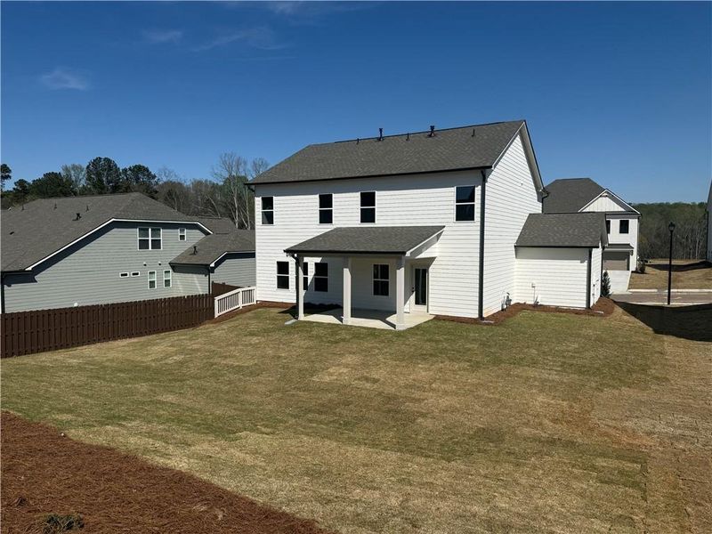 Exterior details and patio area of a home in Rosewood Lake Estates, Hoschton (Image 18).