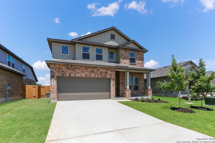 Front exterior of a new home in Buffalo Crossing – New Phase Now Preselling, Cibolo, TX, highlighting curb appeal (Image 13).