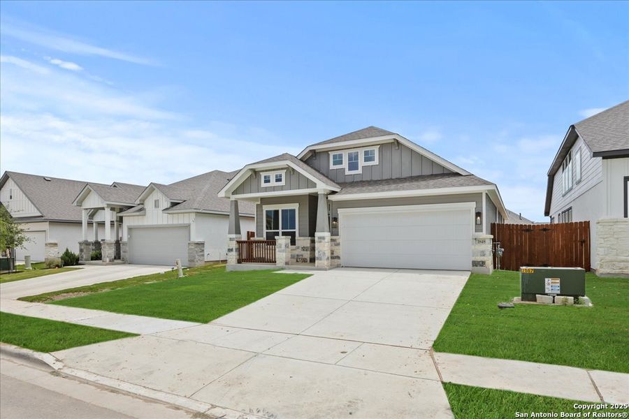 Front exterior of a new home in Meyer Ranch, New Braunfels, TX, highlighting curb appeal (Image 1).