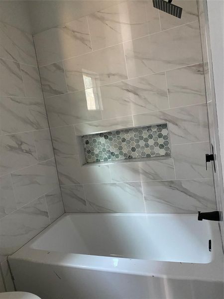 Secondary bathroom with tiled shelf Secondary bathroom with tiled shelf