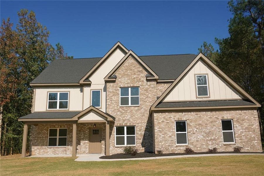 Front exterior of a new home in , Loganville, GA, highlighting curb appeal (Image 29).