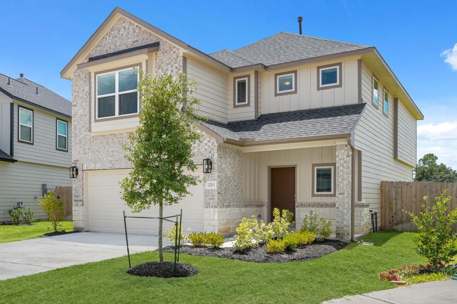 Front exterior of a new home in Grand Oaks Village, Houston, TX, highlighting curb appeal (Image 10). Front exterior of a new home in Grand Oaks Village, Houston, TX, highlighting curb appeal (Image 10).