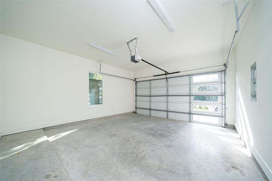 The spacious two-car garage offers both functionality and flexibility, featuring a notable added detail—a full window that brings in natural light. Whether you use the upstairs flex space for fitness or prefer a ground-level option, this garage provides the perfect opportunity to create a bright, comfortable workout area while still offering ample room for parking and storage. The spacious two-car garage offers both functionality and flexibility, featuring a notable added detail—a full window that brings in natural light. Whether you use the upstairs flex space for fitness or prefer a ground-level option, this garage provides the perfect opportunity to create a bright, comfortable workout area while still offering ample room for parking and storage.