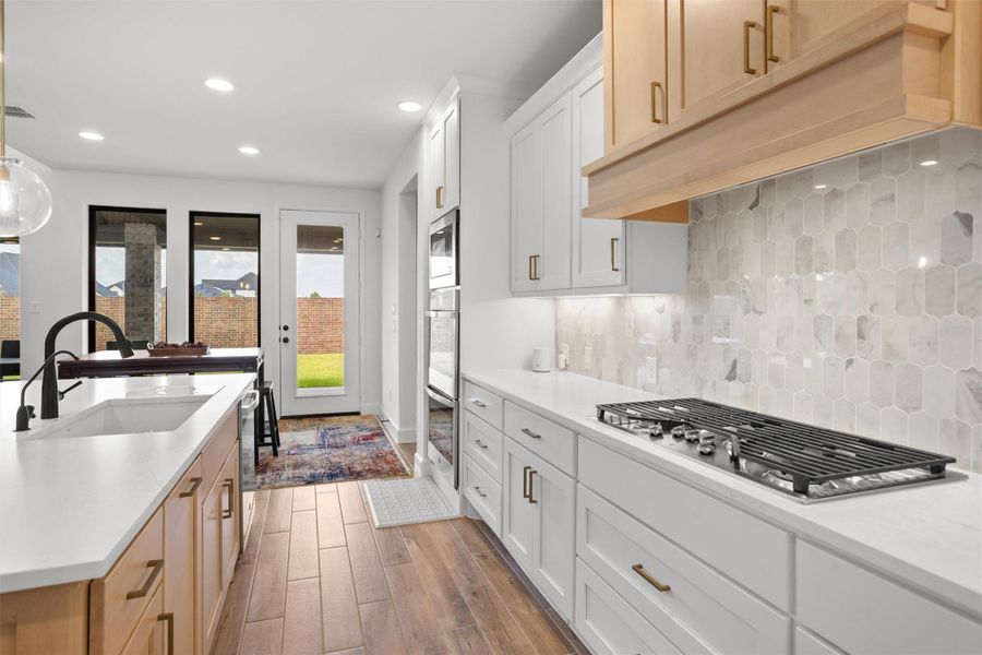 5-burner gas cooktop with statement vent hood