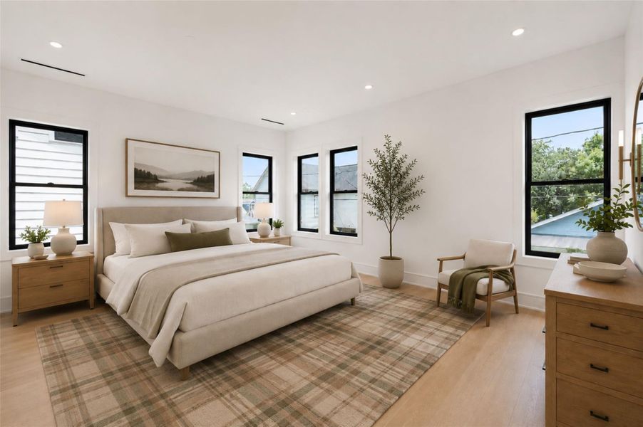 Light-filled primary bedroom. *Virtually staged.