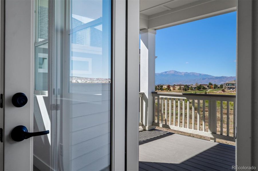 Exterior details and patio area of a home in Revel Crossing at Wolf Ranch - The Panorama Collection, Colorado Springs (Image 28).