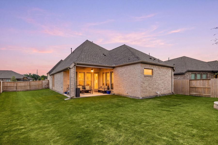 Exterior details and patio area of a home in Meridiana, Manvel (Image 3).