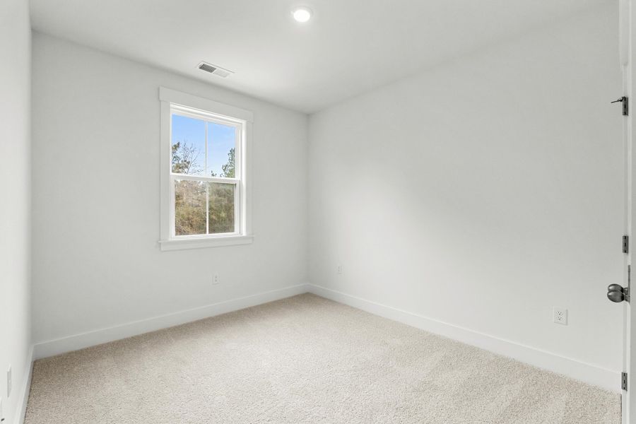 Spacious, unfurnished interior of a new home in Long Bay Golf Club, Longs (Image 39).