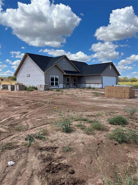 Back of house featuring a garage